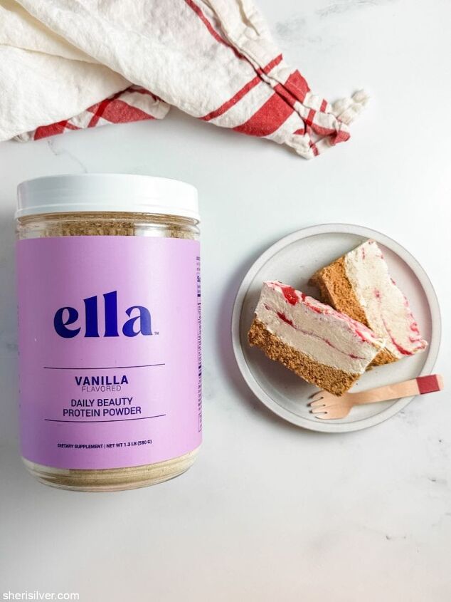 high protein strawberry cottage cheese ice cream bars, strawberry cottage cheese ice cream bars on a white plate next to a jar of Ella protein powder