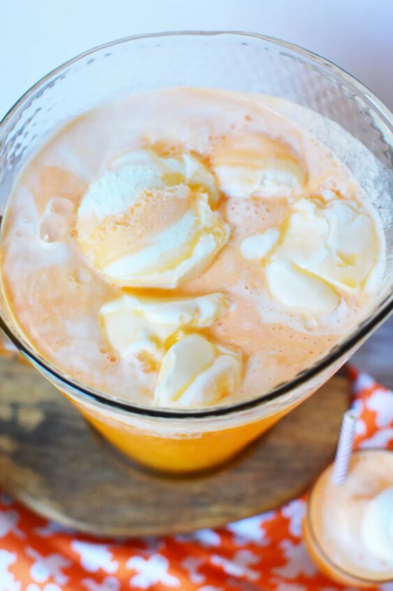 spooky ghost punch, Orange punch with ice cream floating in a pitcher