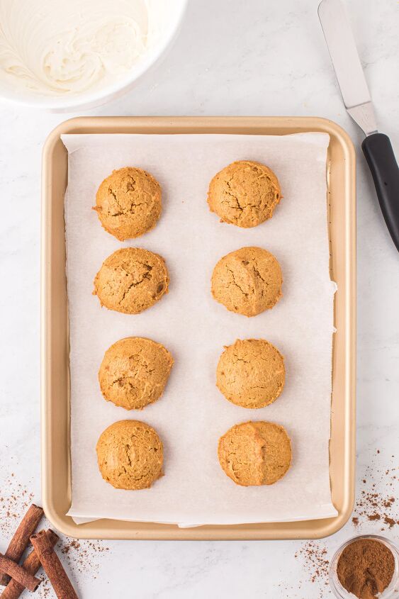 easy pumpkin cookies recipe with frosting, Baked pumpkin cookies on a baking sheet