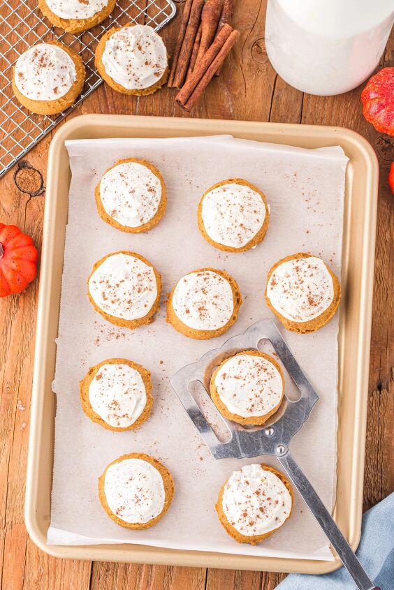 easy pumpkin cookies recipe with frosting, Iced cookies on a baking sheet