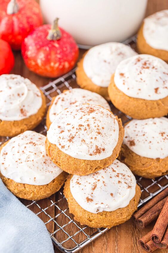 easy pumpkin cookies recipe with frosting, Pumpkin sugar cookies with cream cheese frosting on a rack