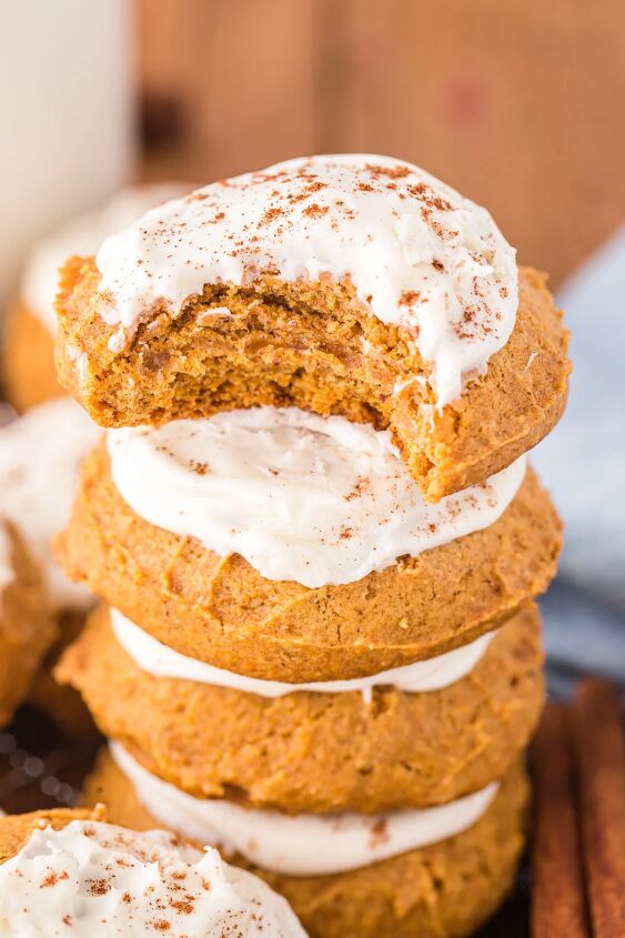 easy pumpkin cookies recipe with frosting, Stacked cookies with the top one missing a bite