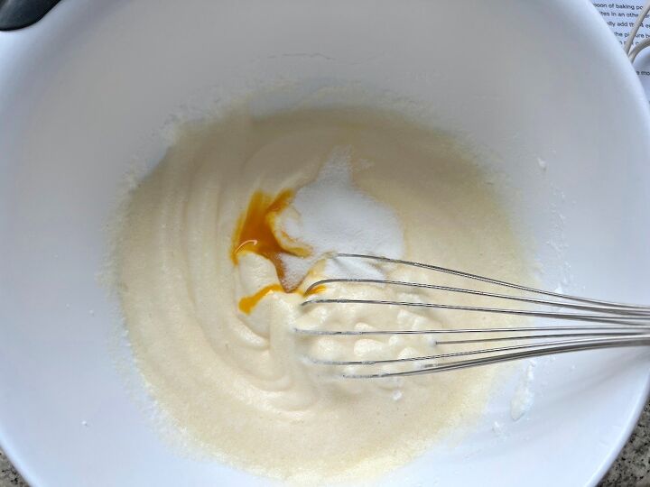 brazilian coconut cake bolo de coco, Whisk in bowl about to mix in egg yolk and sugar into batter for Brazilian Coconut Cake