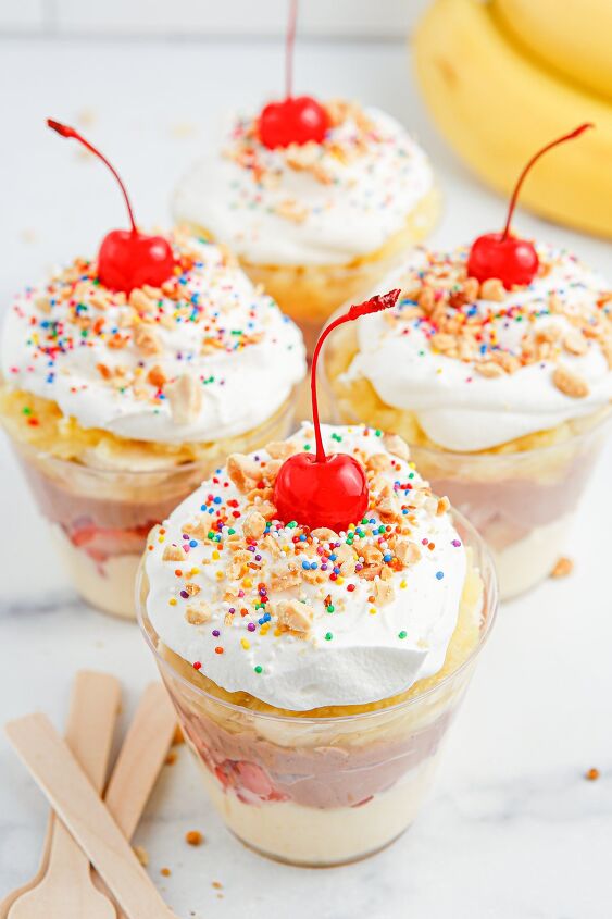 no bake banana split pudding cups recipe, Four banana split pudding cups with whipped cream sprinkles and cherries