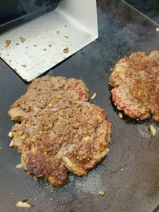 new york chopped cheese sandwich, Seasoned burger patties cooking on a flat top griddle