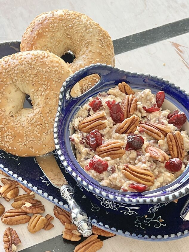 cranberry pecan bagel spread recipe, A Cranberry Pecan Bagel Spread on a tray with two sesame bagels