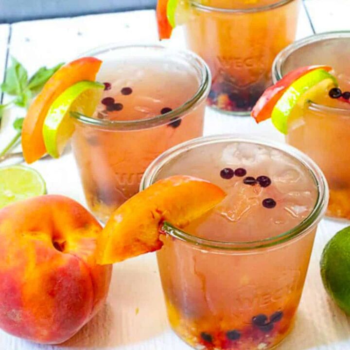 strawberry lemonade protein smoothie refind sugar free, featured image blueberry and peach vodka spritzer