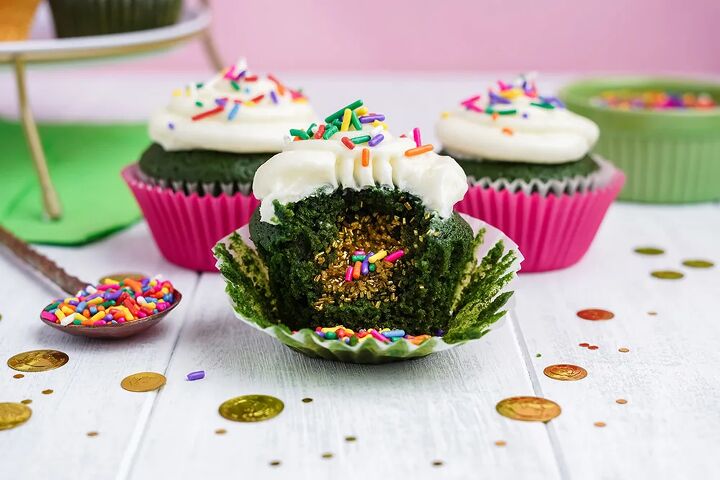 stuffed green velvet cupcakes, Three green cupcakes with one showing the surprise filling