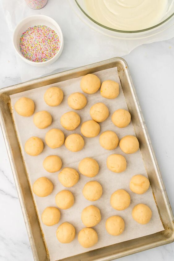 light and creamy lemon oreo truffles, Lemon oreo balls on a baking sheet