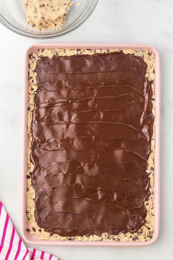cookie dough bark, Chocolate on top of cookie dough in a tray