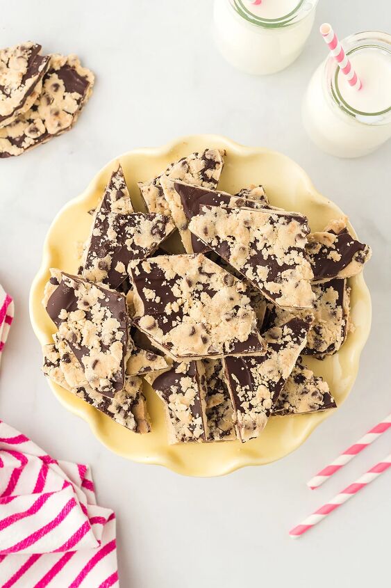 cookie dough bark, A yellow plate with cookie dough bark candy next to milk