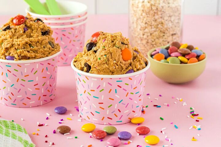 edible monster cookie dough, Cups of monster cookie dough next to M M candies and oats
