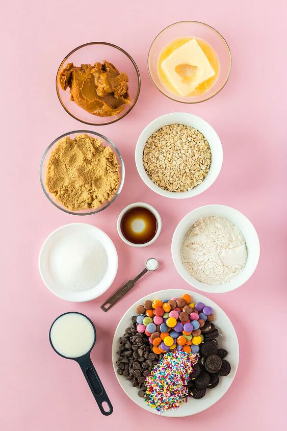 edible monster cookie dough, Butter sugar oats and other ingredients in bowls on pink table