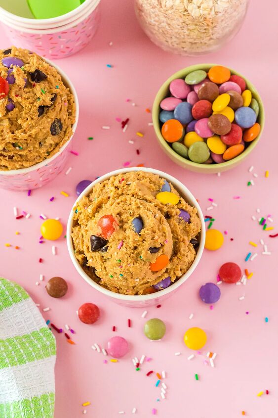 edible monster cookie dough, Overhead image of monster cookie dough in cups with candy on the table