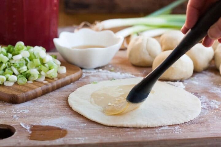 crispy scallion pancakes, Brushing oil on the dough rounds for crispy scallion pancakes