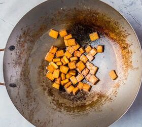 vegan stir fry noodles ready in under 30 minutes, Frying tofu in a wok pan