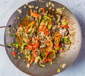 vegan stir fry noodles ready in under 30 minutes, Adding the sauce to a wok with cooked vegetables