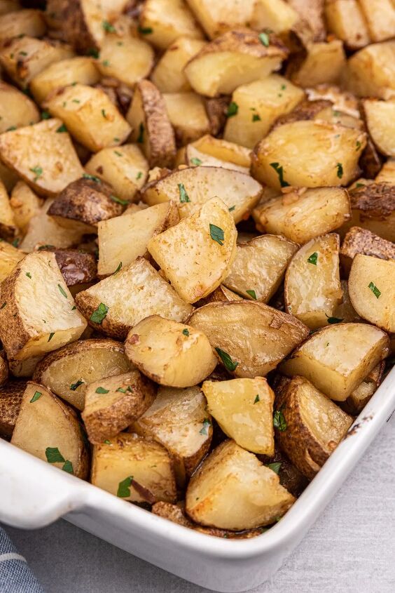 easy roasted potatoes made with one magic packet, angled down view of baking dish full of roasted potatoes