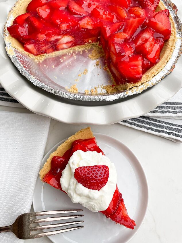 no bake strawberry pie with jello, piece of strawberry pie in a white plate next to strawberry pie in white pie plate