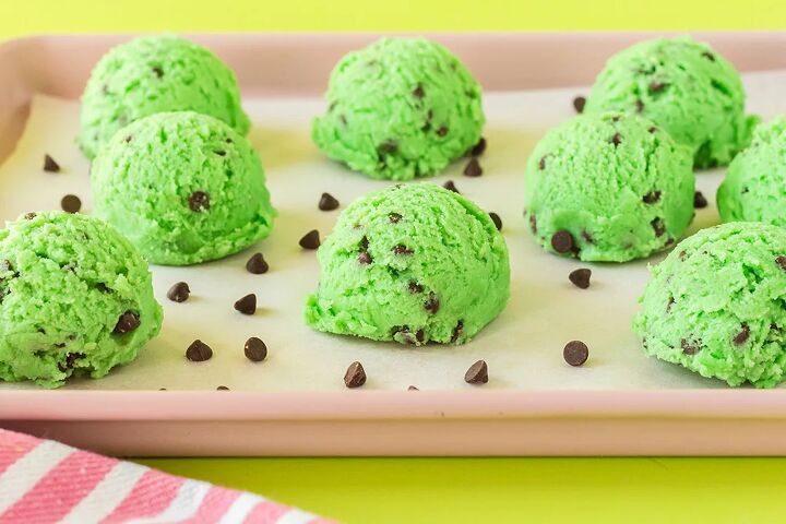 mint chip edible cookie dough, Scoops of green dough with mini chocolate chips on baking sheet