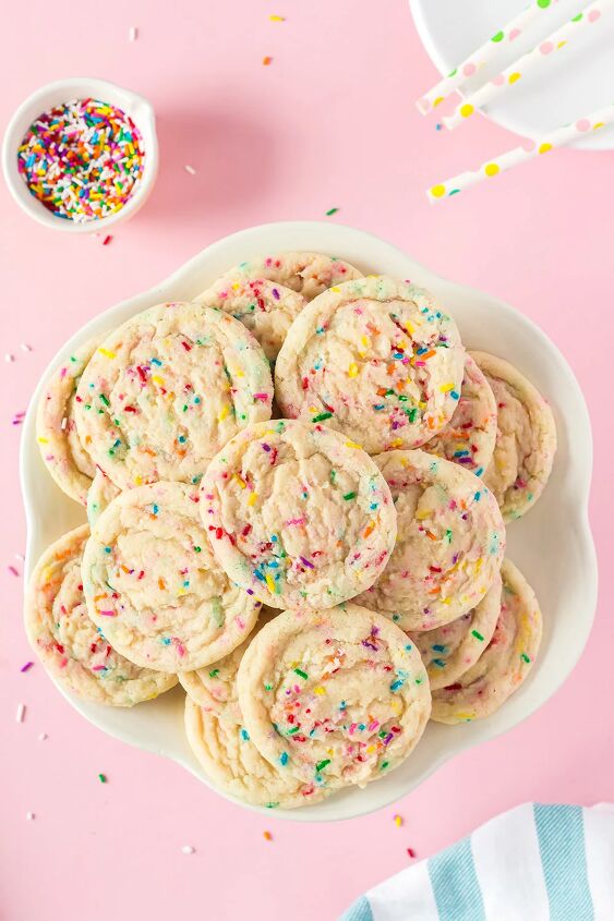 soft and chewy funfetti cookies recipe, Plate full of funfetti cookies next to a bowl of sprinkles