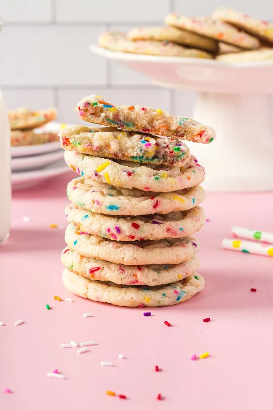 soft and chewy funfetti cookies recipe, Stack of funfetti cookies with more on a stand in the background