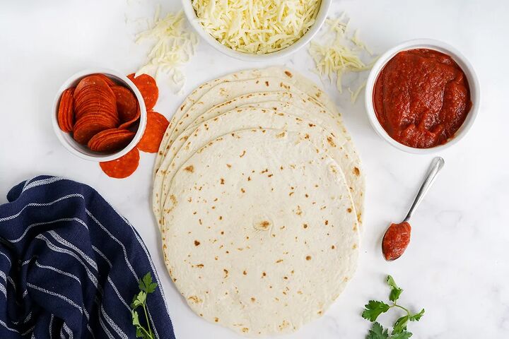 skillet pepperoni pizza quesadillas recipe, Tortillas cheese pepperoni and sauce on a table