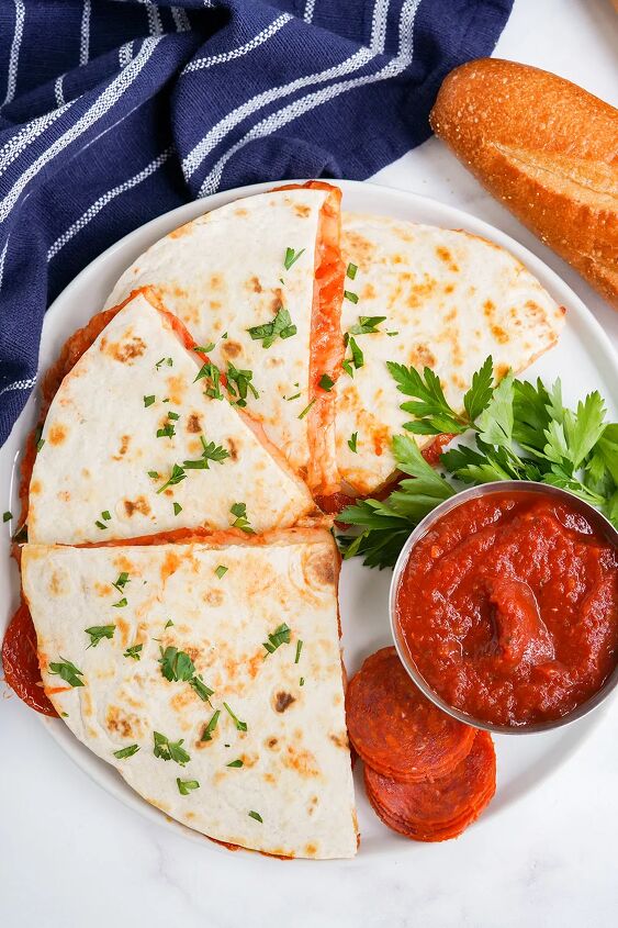 skillet pepperoni pizza quesadillas recipe, Sliced quesadillas on a plate with dipping sauce
