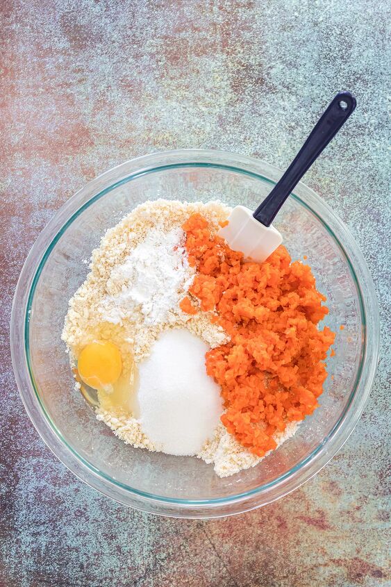 unique carrot cookies with orange juice glaze, Carrots flour butter and egg in a mixing bowl