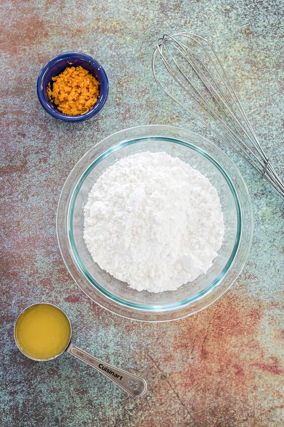 unique carrot cookies with orange juice glaze, Powdered sugar orange juice and carrots in bowls