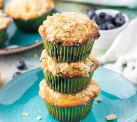 blueberry orange muffins with crunchy oat topping, Three muffin stacked on top of each other on a blue plate