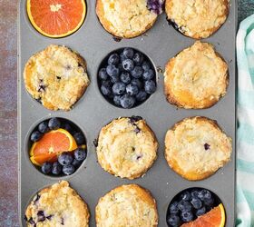 blueberry orange muffins with crunchy oat topping, Muffin tin with muffins oranges and blueberries in it