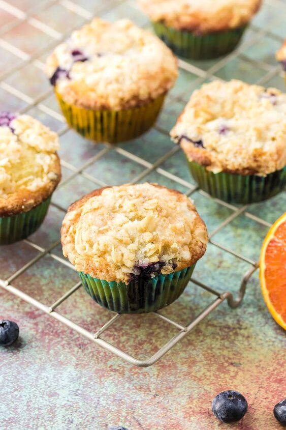blueberry orange muffins with crunchy oat topping, Blueberry orange muffins on a rack