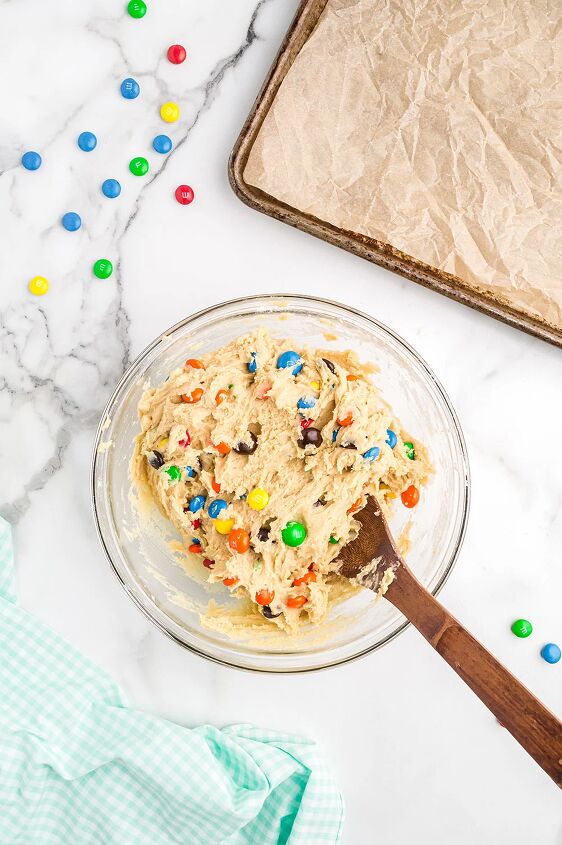 the best m m cookies sugar cookies with m ms, Stirring candies into a mixing bowl with batter