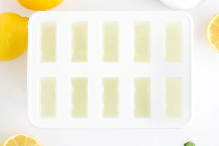 easy and refreshing lemon popsicles, Lemon mixture poured into a white popsicle mold