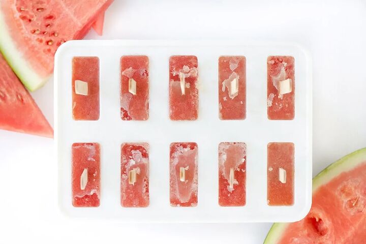 fresh watermelon popsicles recipe, Popsicle mold with red liquid and popsicles sticks in it