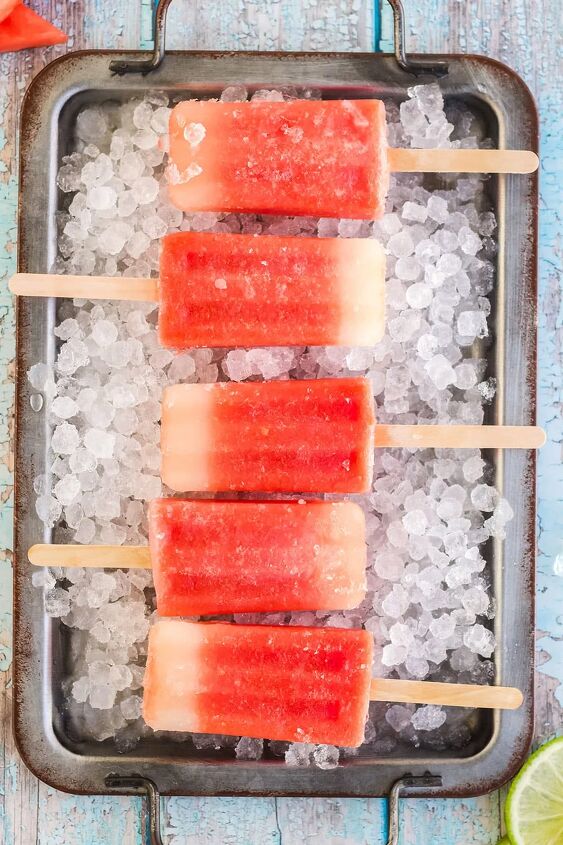 fresh watermelon popsicles recipe, Watermelon pops lined up in a tray with ice
