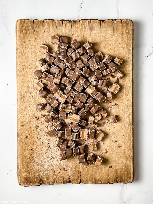 milky way brownies, sliced milky way bars on a wooden board
