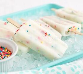 happy funfetti cake batter popsicles, Cake batter popsicles laying on ice in a blue tray