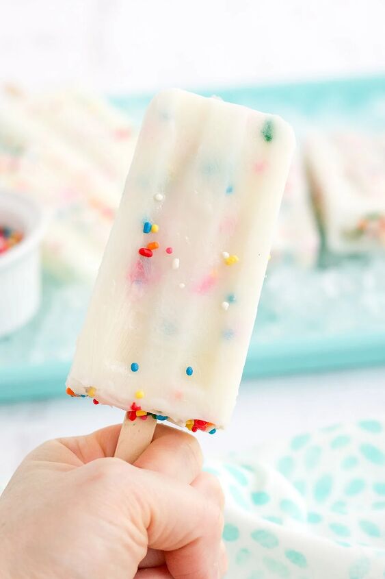 happy funfetti cake batter popsicles, Holding a cake mix popsicle