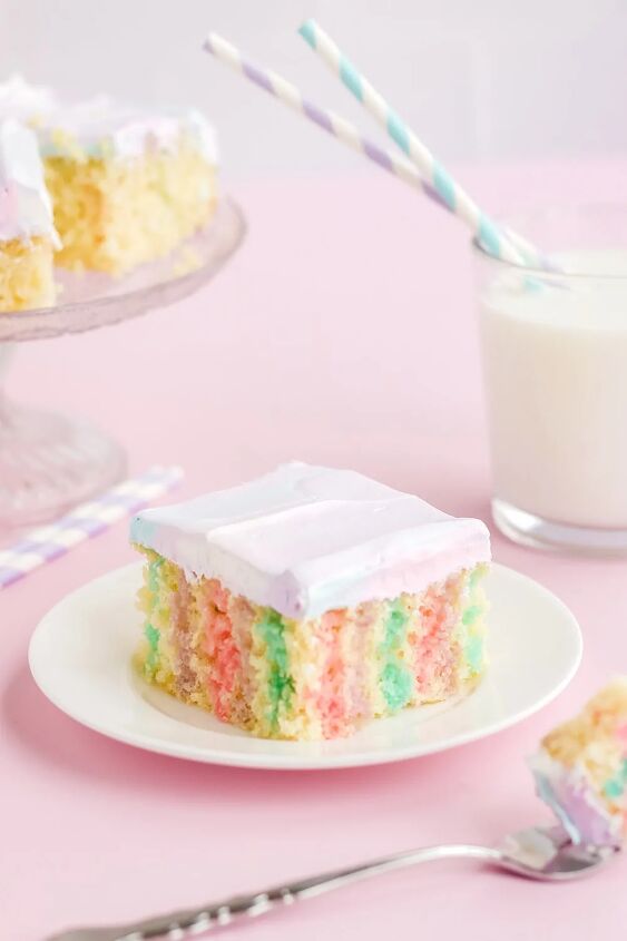rainbow unicorn poke cake recipe, Colorful cake on a plate with milk and more cake in the background