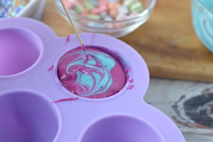 mermaid hot chocolate bombs, Purple and blue melted chocolate in a candy mold