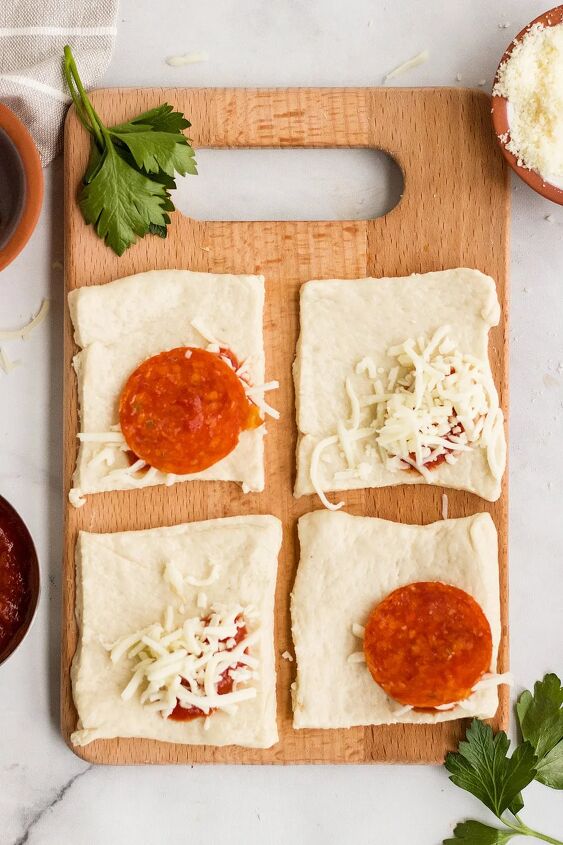 air fryer pizza pockets diy pizza rolls, Unrolled pizza pockets with ingredients on a board