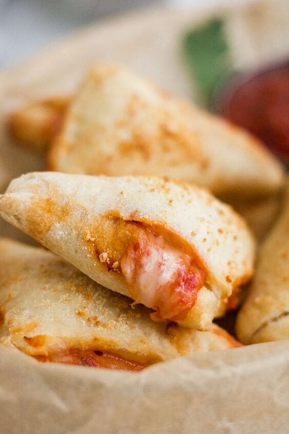 air fryer pizza pockets diy pizza rolls, Pizza roll with some cheese and sauce oozing out