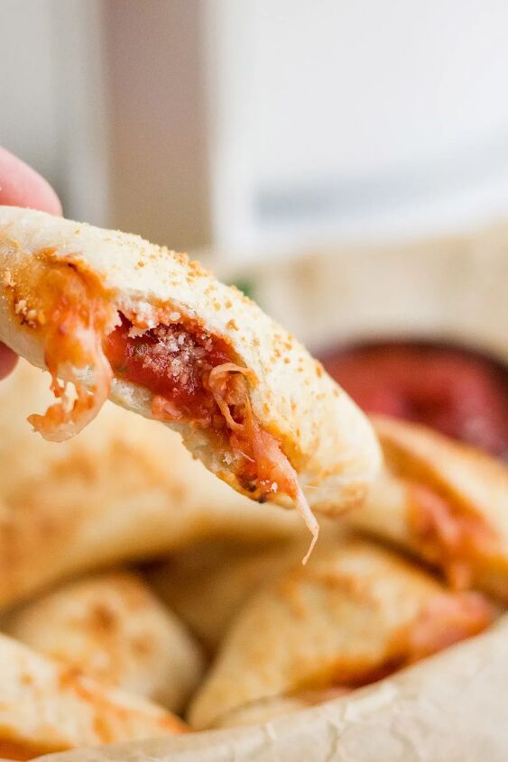 air fryer pizza pockets diy pizza rolls, Bite out of a pizza roll showing sauce and cheese