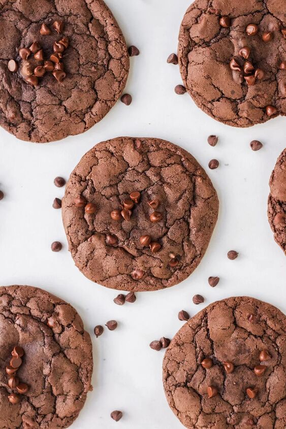 chewy brownie mix cookies recipe, Overhead shot of brownie mix cookies and chocolate chips on a white table