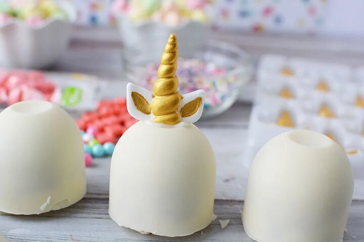 adorable unicorn hot chocolate bombs, White unicorn hot chocolate bomb with gold horn and ears