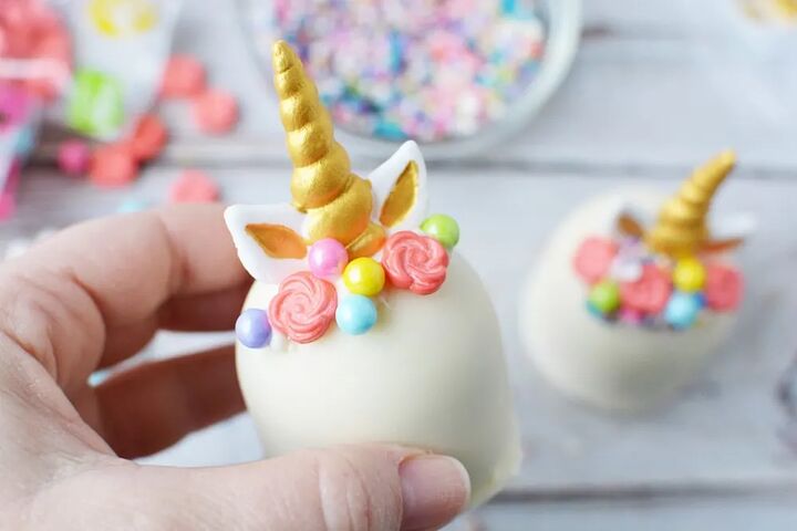 adorable unicorn hot chocolate bombs, White chocolate unicorn hot chocolate bomb with horn ears and mane