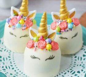 adorable unicorn hot chocolate bombs, Three white unicorn hot chocolate bombs with faces horns ears and manes