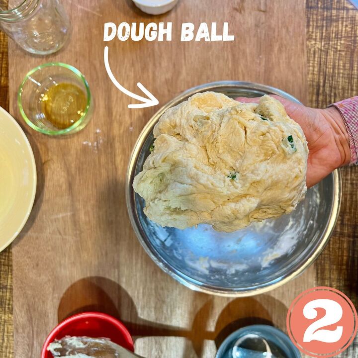 easy vegan flour tortillas using a press, a hand holding a vegan dough ball
